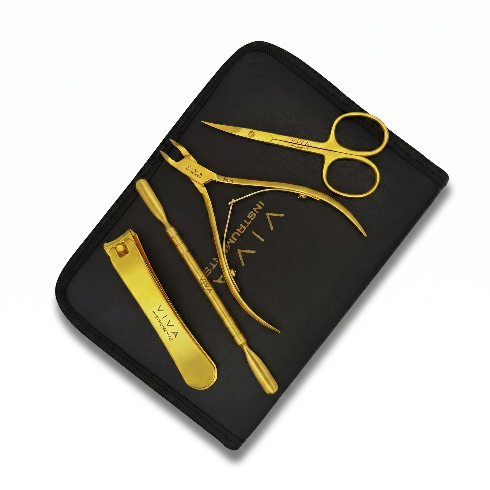 Gold nail care tools including scissors, pliers, and nail clipper on a black case with 'VIVA' branding. - viva instruments
