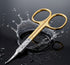 Gold and silver cuticle nail scissors with water splash on a dark background - viva instruments 