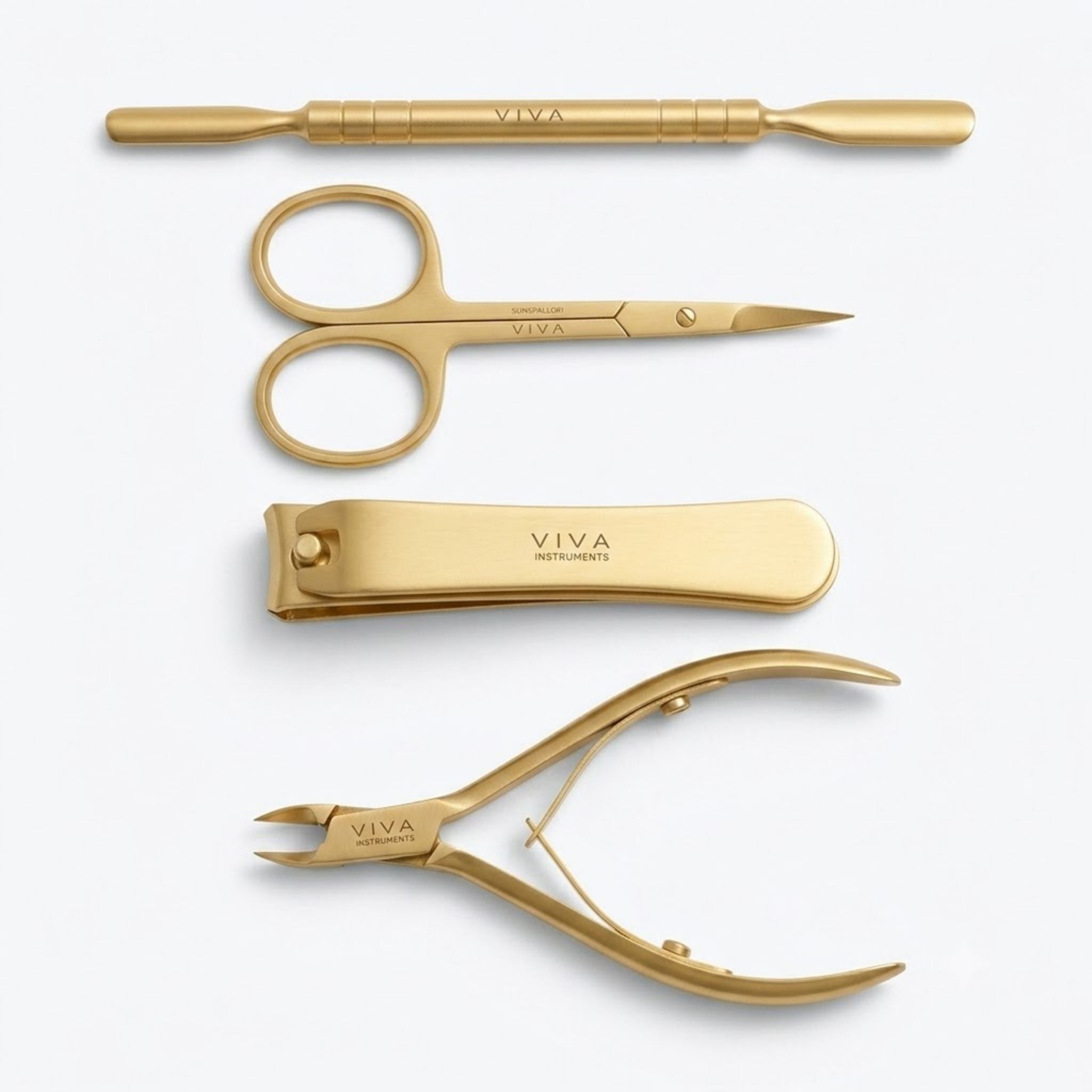 Set of gold professional nail manicure tools with 'VIVA' branding on a white background  Viva Instruments