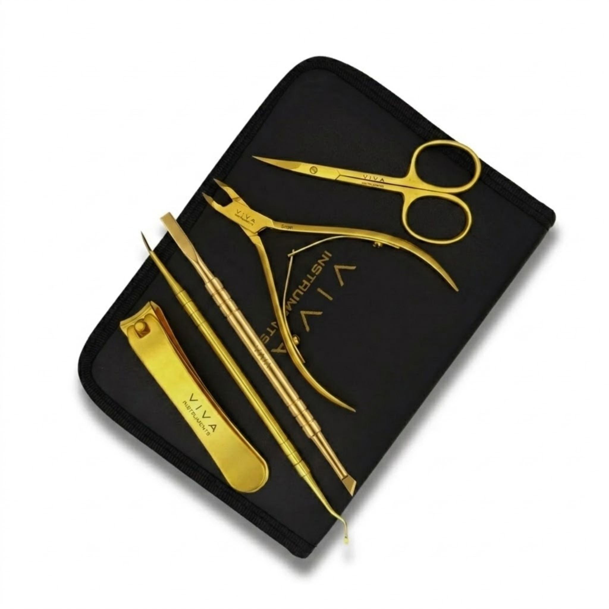 Gold nail care tools including scissors, clippers, and files in a black case on a white background - viva instruments 