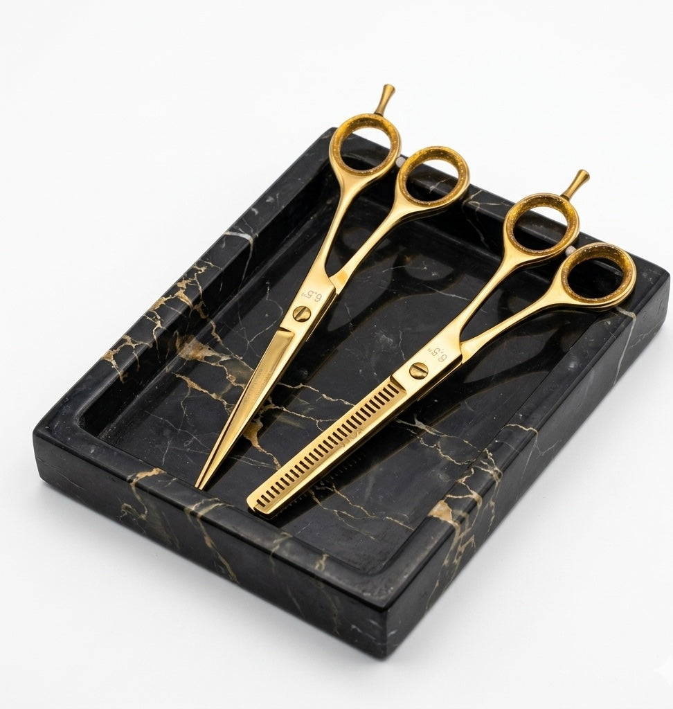 Set of gold scissors on a black marble tray - viva instruments 