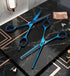 Blue hair cutting scissors and shears on a black marble surface - viva instrunents 