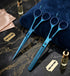 Set of blue hairdressing scissors on a dark marble surface with razors and towels - Viva Instruments 
