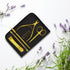 Gold beauty tool set with 'VIVA' branding on a black tray, surrounded by lavender flowers. manicure tools - viva instruments
