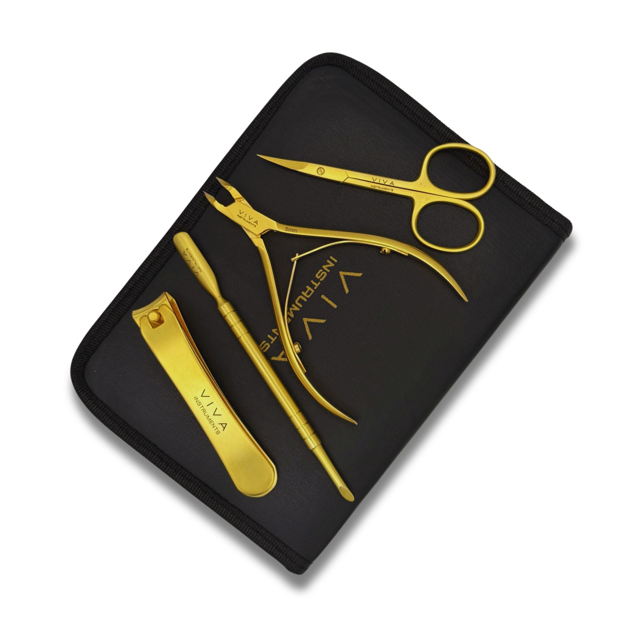 Set of gold manicure tools including scissors, clippers, and nail clipper on a black case with 'VIVA' branding.