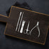 Set of nail care tools on a wooden board with a black background - viva instruments 