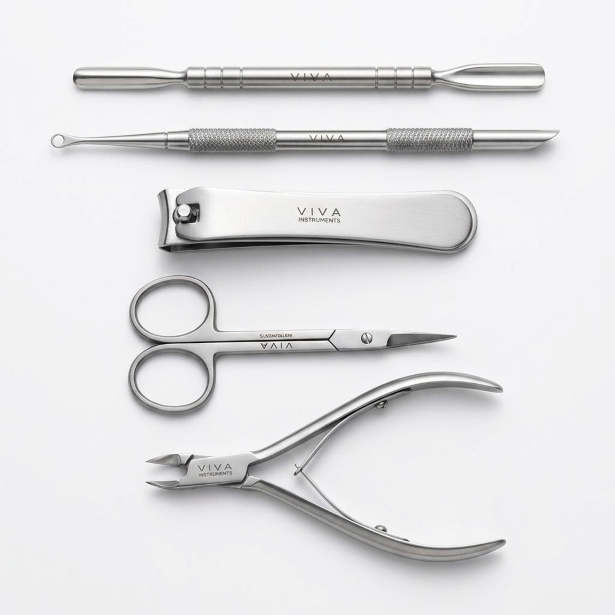 Set of professional VIVA nail care tools including scissors, pliers, and files and pushers on a white background - viva instruments