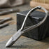 Silver nipper with 'VIVA' branding on a stone surface - viva instruments 