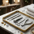 Set of nail care tools on a marble tray with decorative items in a salon setting - viva instruments