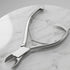 Metal nail clippers on a marble surface - viva instruments